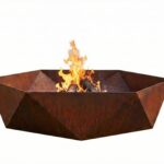 Modern hexagonal Corten steel fire pit with actively burning wood logs