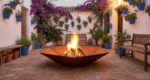 Corten steel hexagonal fire pit Diamond Hex burning wood in a modern pation in Andalusia
