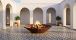 Corten Diamond Octagon fire pit in an elegant Mediterranean patio with white arches and patterned flooring.